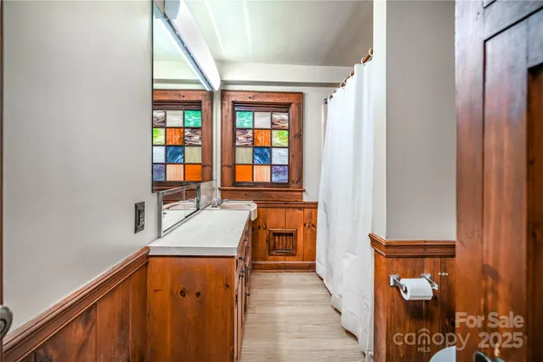 a view of a hallway with furniture and entryway