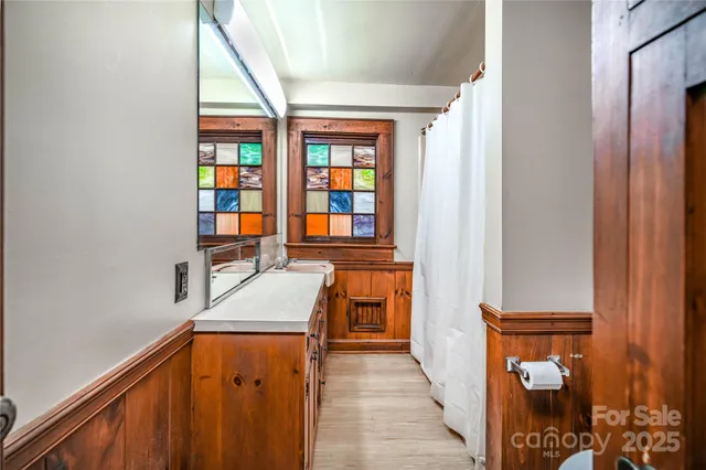 a view of a hallway with furniture and entryway
