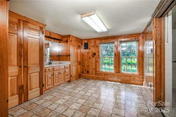 a large empty room with windows