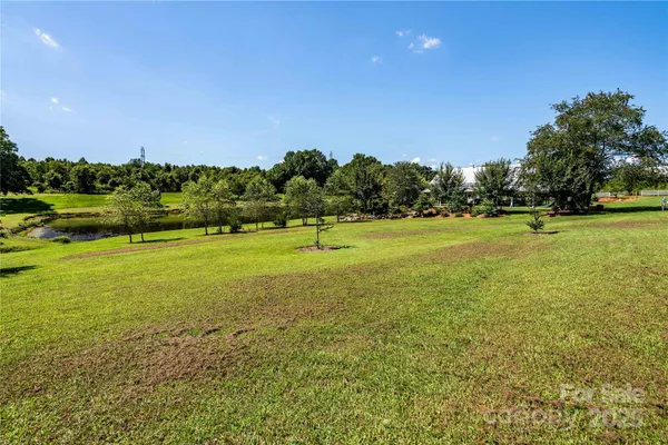 a view of a green field with clear sky