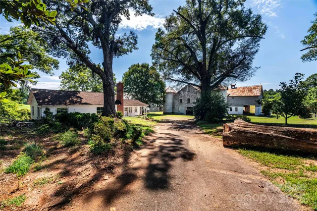a view of a yard with swimming pool