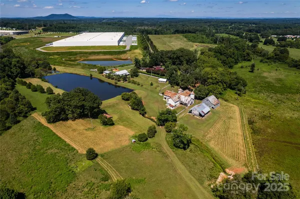 an aerial view of a house with a lake view