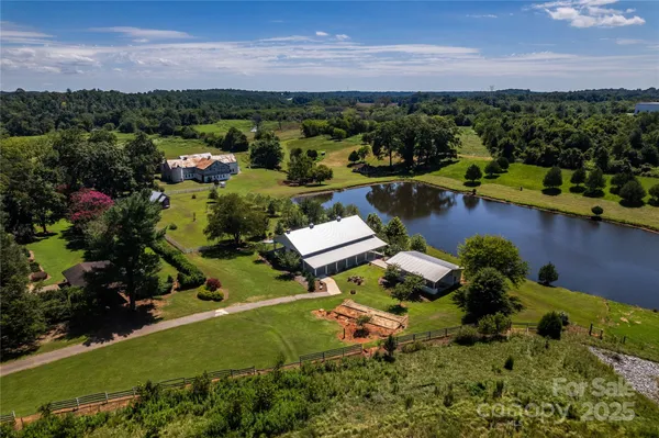 an aerial view of a houses with a yard