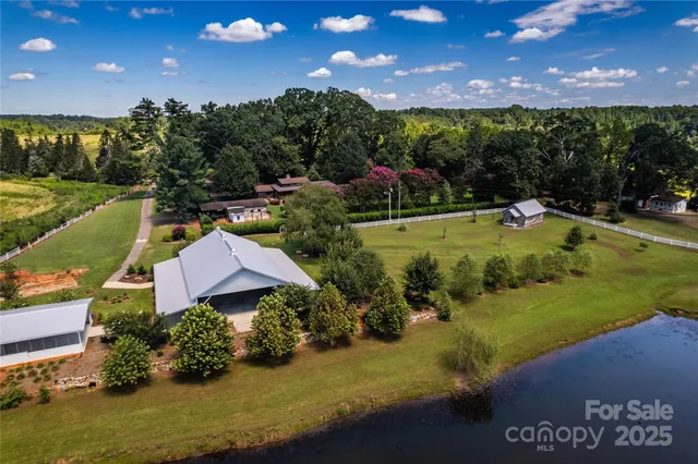a view of a house with a yard and a large pool