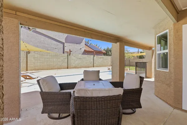 a view of a dining room with furniture wooden floor and a chandelier