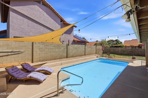 a view of a patio with swimming pool