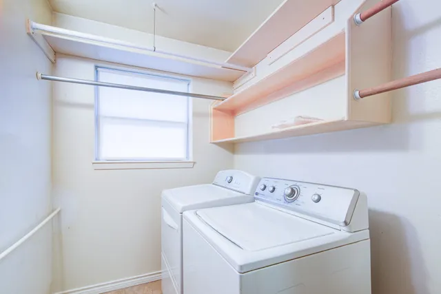 a utility room with dryer and washer