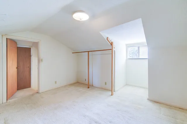an empty room with closet area