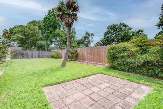 a backyard of a house with lots of green space