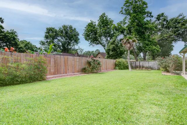 a backyard of a house with lots of green space