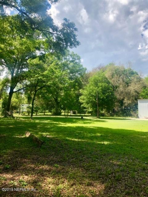 2022 Bennett Road Green Cove Springs, FL 32043 - Photo 4 of 28 a view of a big yard with a large trees