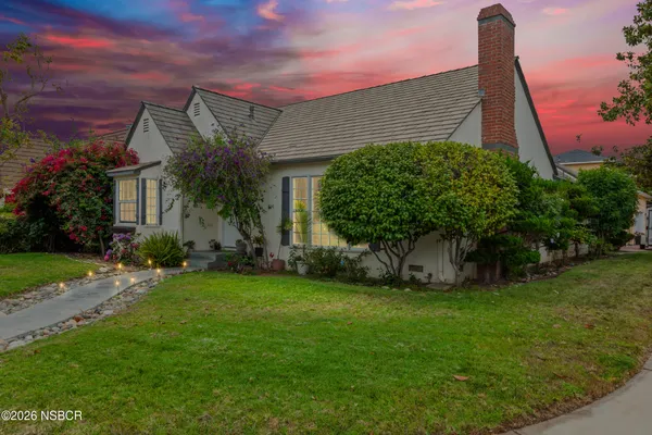 front view of a house with a yard