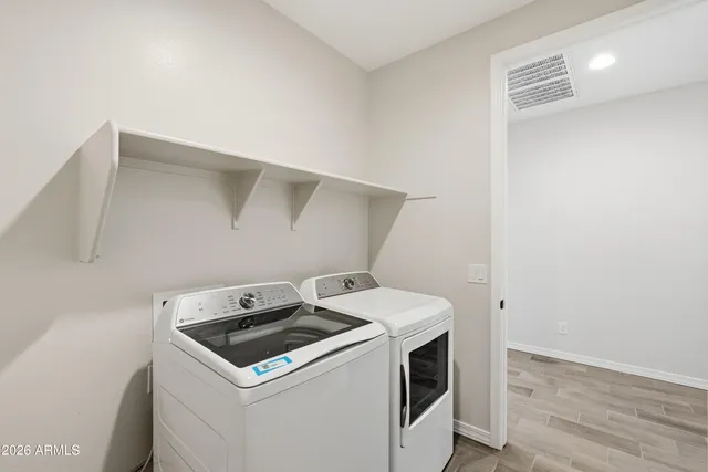 a utility room with dryer and washer