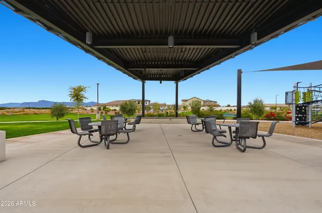 a view of a tables and chairs in patio