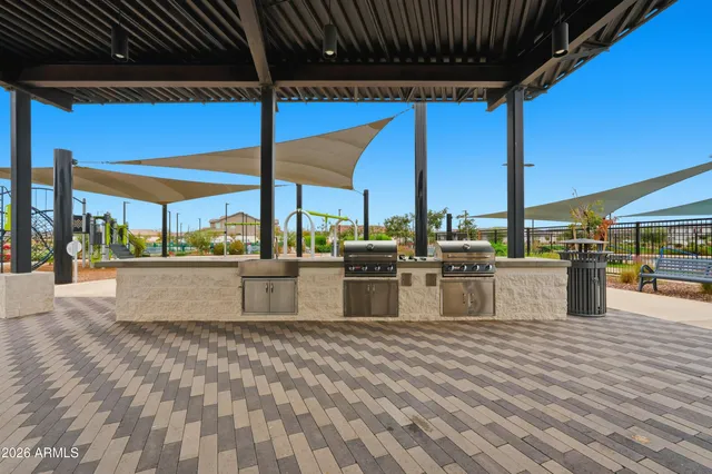 a view of a swimming pool with outdoor seating