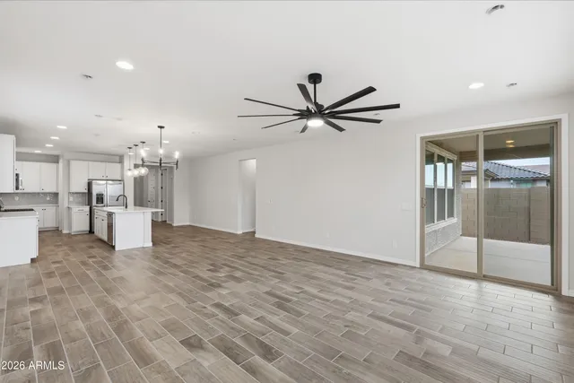 a view of a livingroom with a kitchen