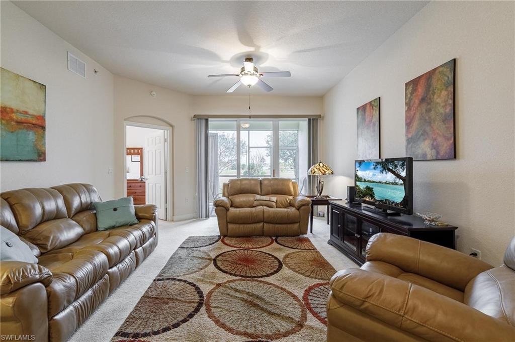 17298 Acapulco Road, Unit 512 Punta Gorda, FL 33955 - Photo 15 of 34 a living room with furniture and a large window