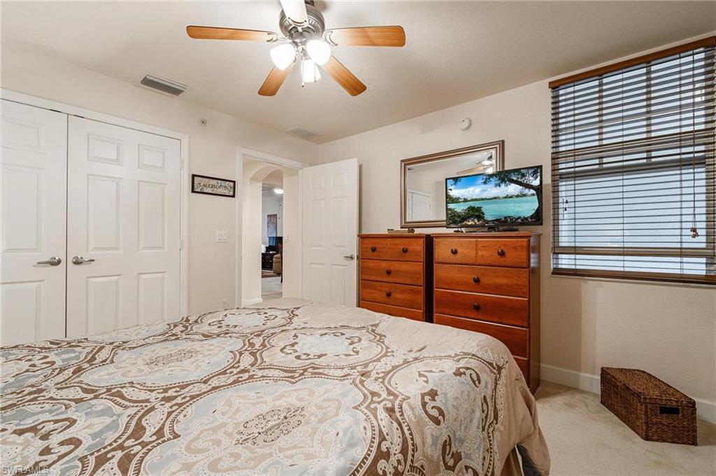 17298 Acapulco Road, Unit 512 Punta Gorda, FL 33955 - Photo 22 of 34 a bedroom with a bed and a flat tv screen on dresser