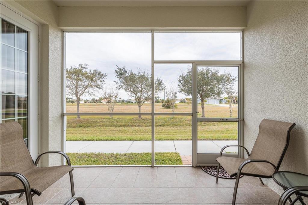 17298 Acapulco Road, Unit 512 Punta Gorda, FL 33955 - Photo 25 of 34 a view of a room with a large window and chairs