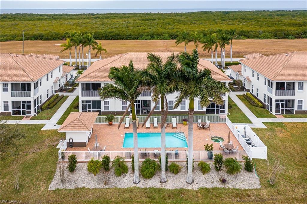 17298 Acapulco Road, Unit 512 Punta Gorda, FL 33955 - Photo 27 of 34 a front view of a house with a yard