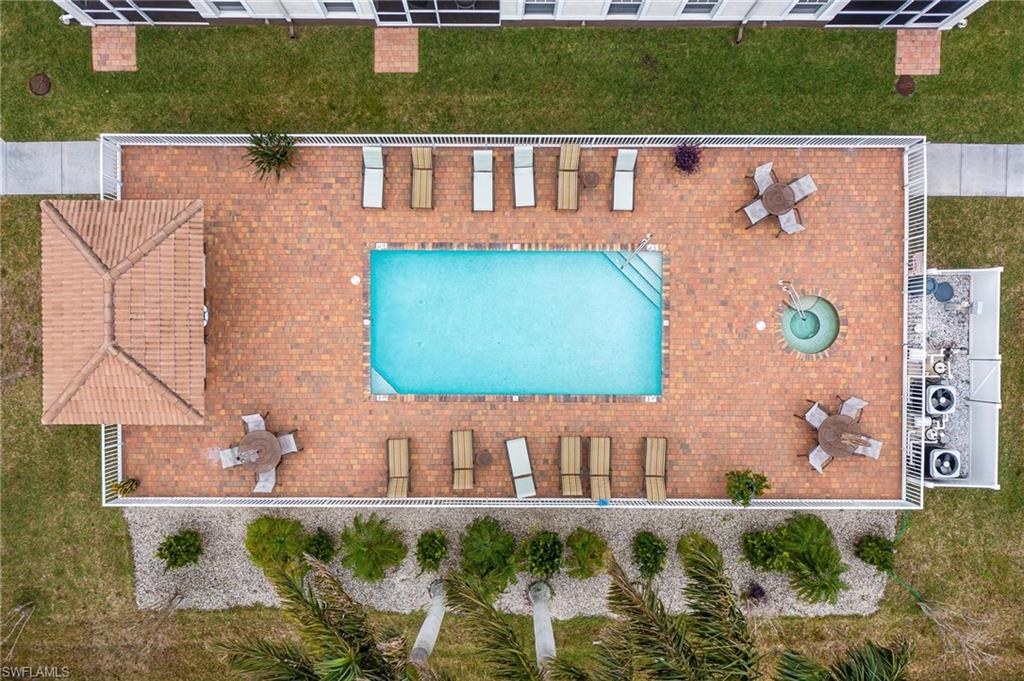17298 Acapulco Road, Unit 512 Punta Gorda, FL 33955 - Photo 28 of 34 an aerial view of a house with a yard and lake view