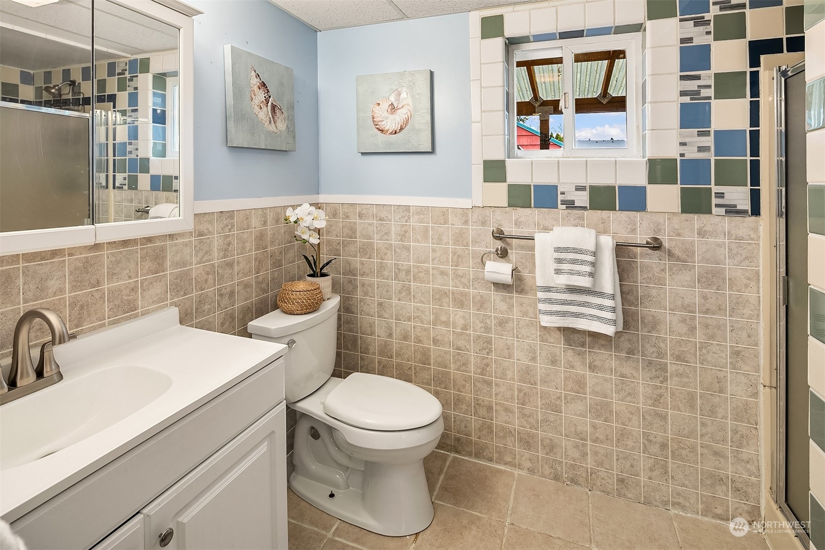 39152 Southeast Delta Street Snoqualmie, WA 98065 - Photo 19 of 26 a bathroom with a toilet sink and mirror