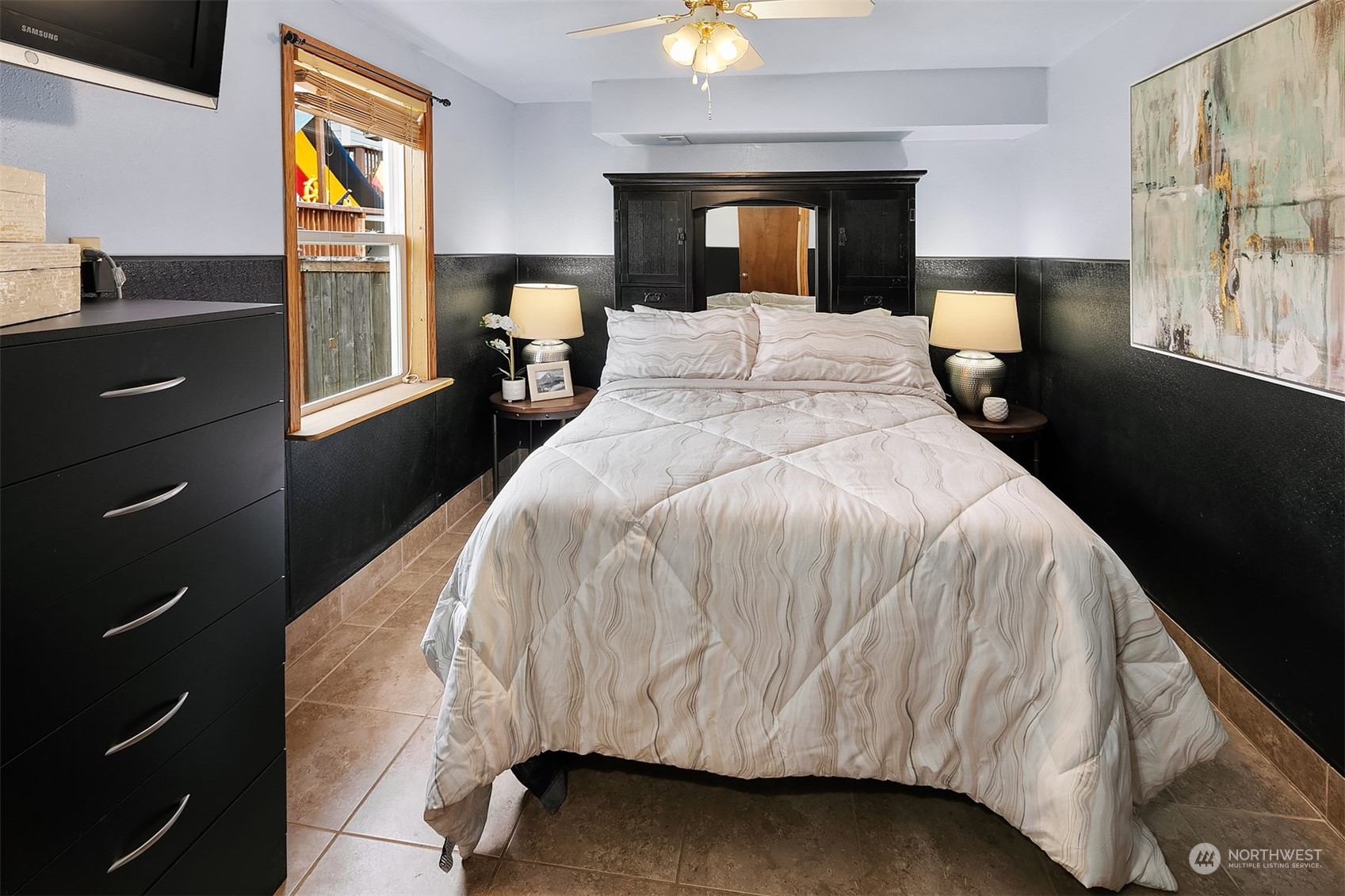 39152 Southeast Delta Street Snoqualmie, WA 98065 - Photo 20 of 26 a bedroom with a bed and a chandelier