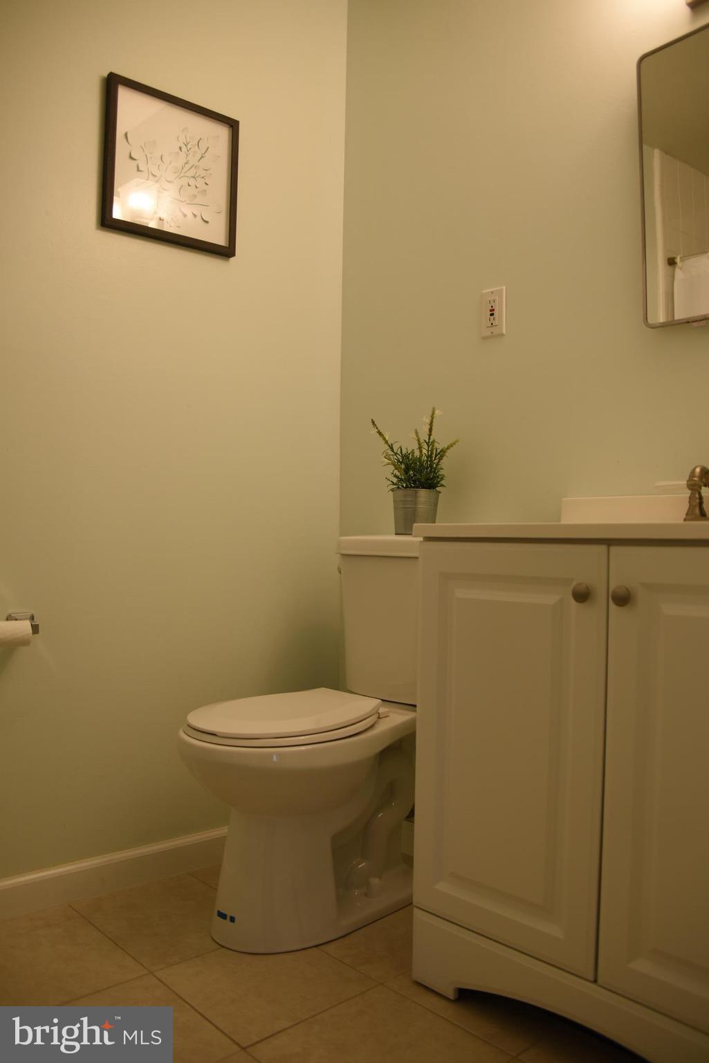 8911 Victoria Road Springfield, VA 22151 - Photo 12 of 22 a bathroom with a toilet and a sink