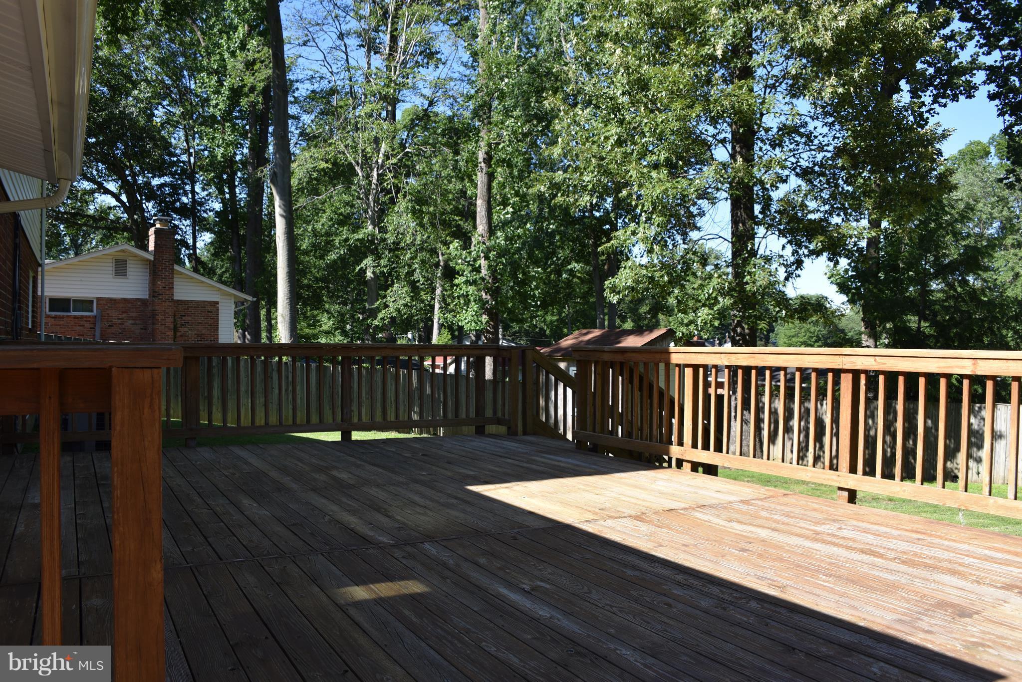 8911 Victoria Road Springfield, VA 22151 - Photo 20 of 22 a view of a wooden deck