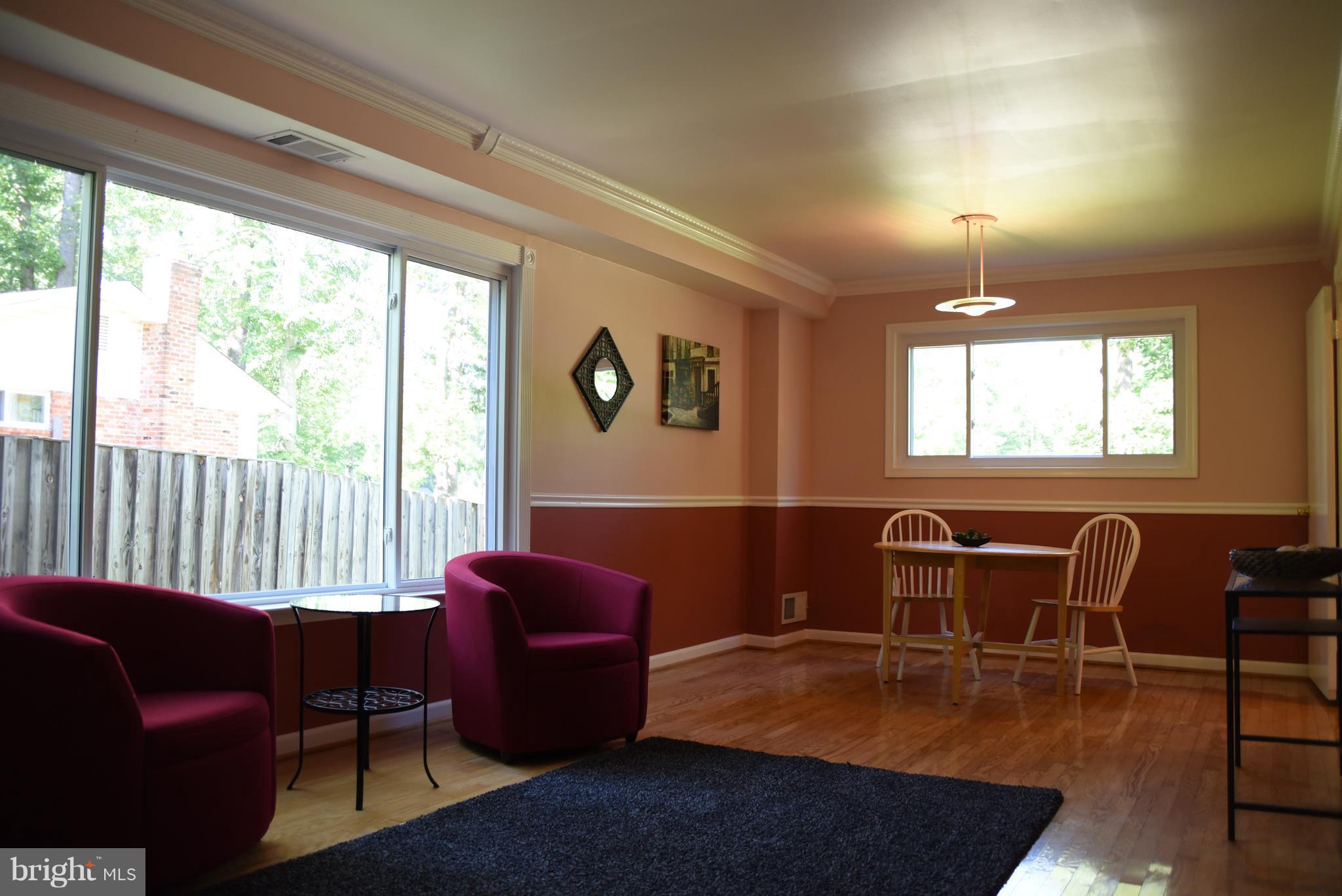 8911 Victoria Road Springfield, VA 22151 - Photo 4 of 22 a view of a livingroom with furniture window and outside view