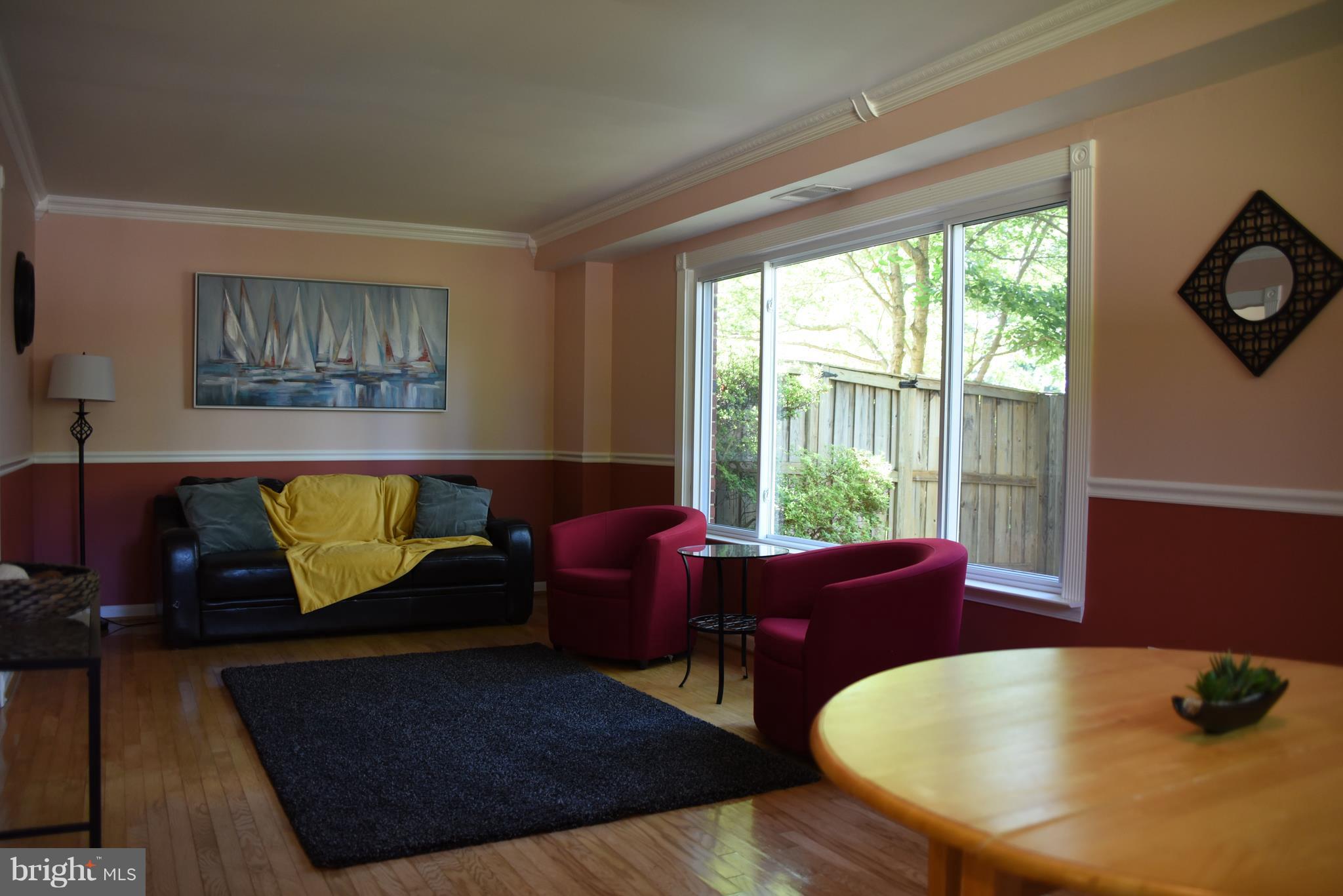 8911 Victoria Road Springfield, VA 22151 - Photo 5 of 22 a living room with furniture and a large window