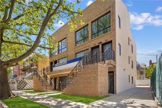 a view of a building with a street