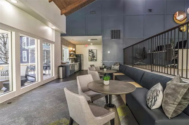 a dining room with furniture and wooden floor