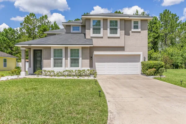 front view of a house with a yard