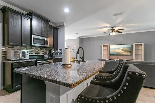 a kitchen with counter top space cabinets and stainless steel appliances