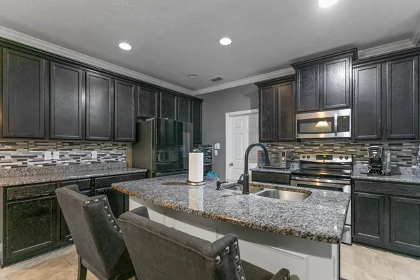 a view of a room with furniture and windows