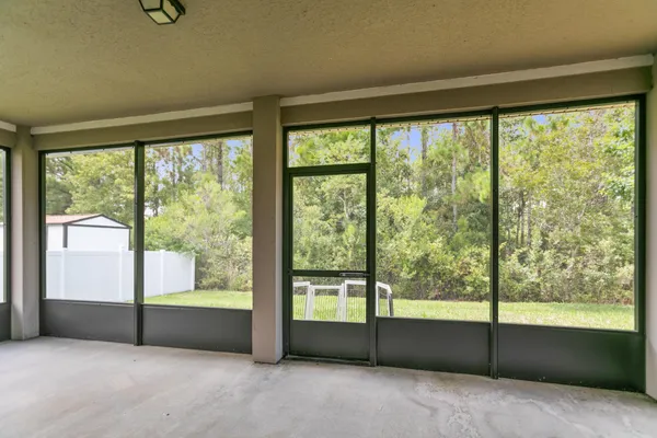 a view of an empty room with a fireplace
