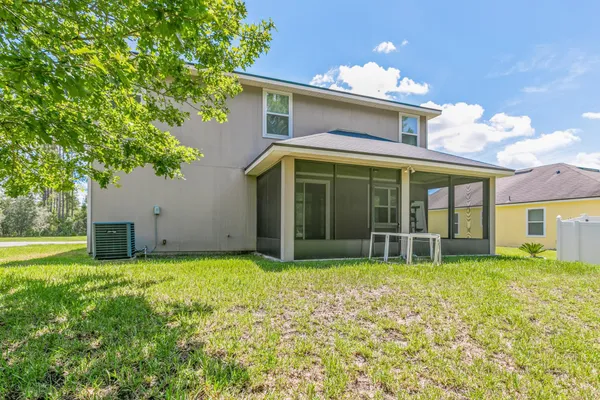 a view of a house with yard and garden