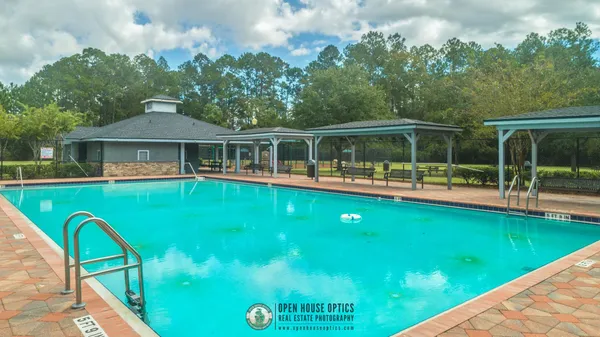 a view of a two chairs in the balcony