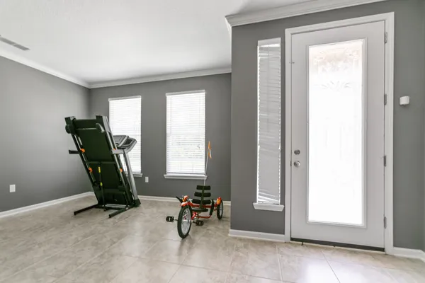 a view of a livingroom with furniture and stairs