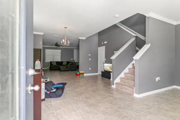 a living room with furniture and a window