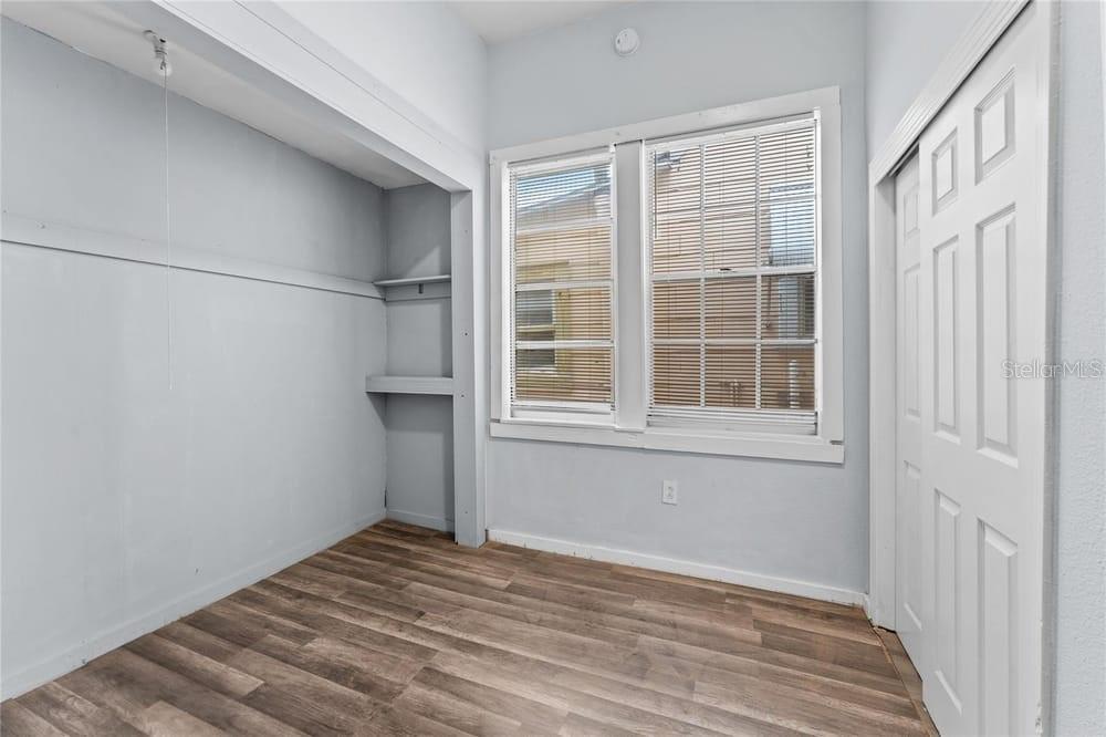 2320 West Walnut Street Tampa, FL 33607 - Photo 16 of 19 a view of empty room with wooden floor and fan