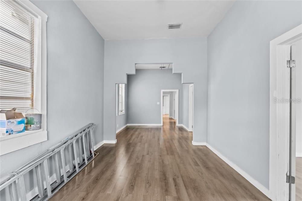 2320 West Walnut Street Tampa, FL 33607 - Photo 3 of 19 a view of a hallway with wooden floor