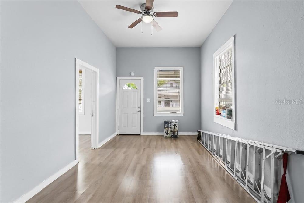 2320 West Walnut Street Tampa, FL 33607 - Photo 4 of 19 wooden floor in an empty room with a window