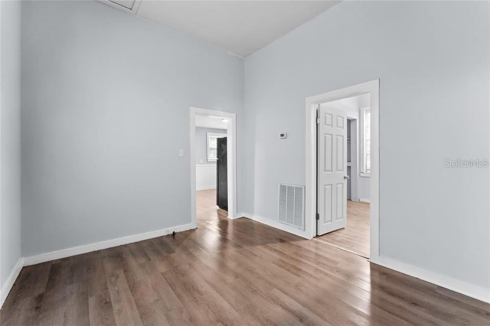 2320 West Walnut Street Tampa, FL 33607 - Photo 8 of 19 a view of wooden floor and windows in a room