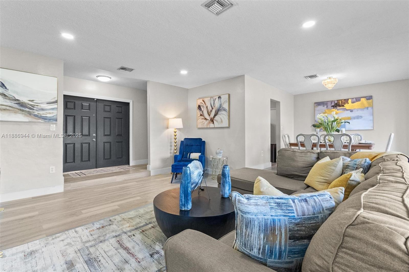 a living room with furniture and a window