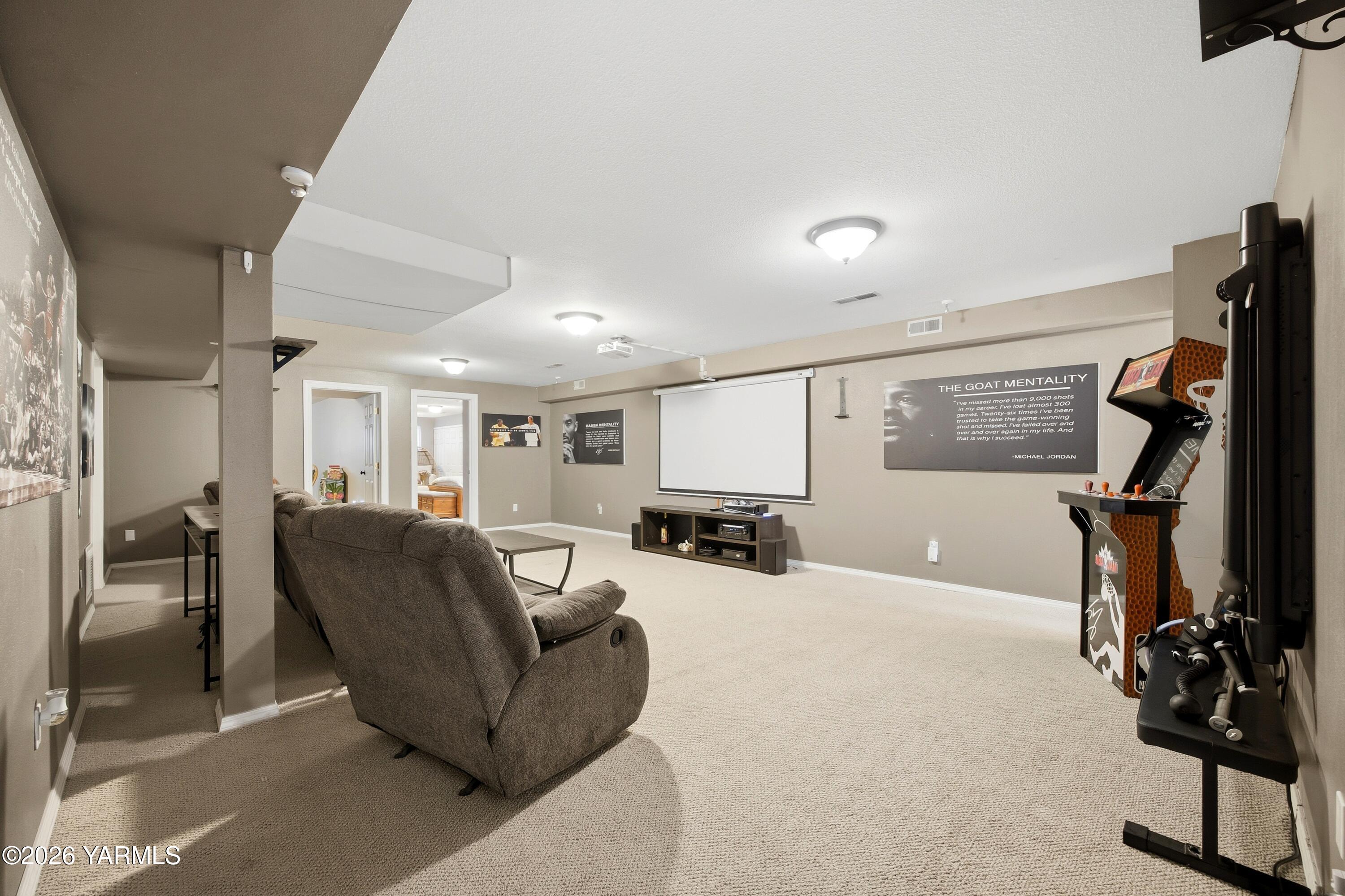 1681 Olmstead Road Grandview, WA 98930 - Photo 12 of 49 a living room with furniture and a flat screen tv