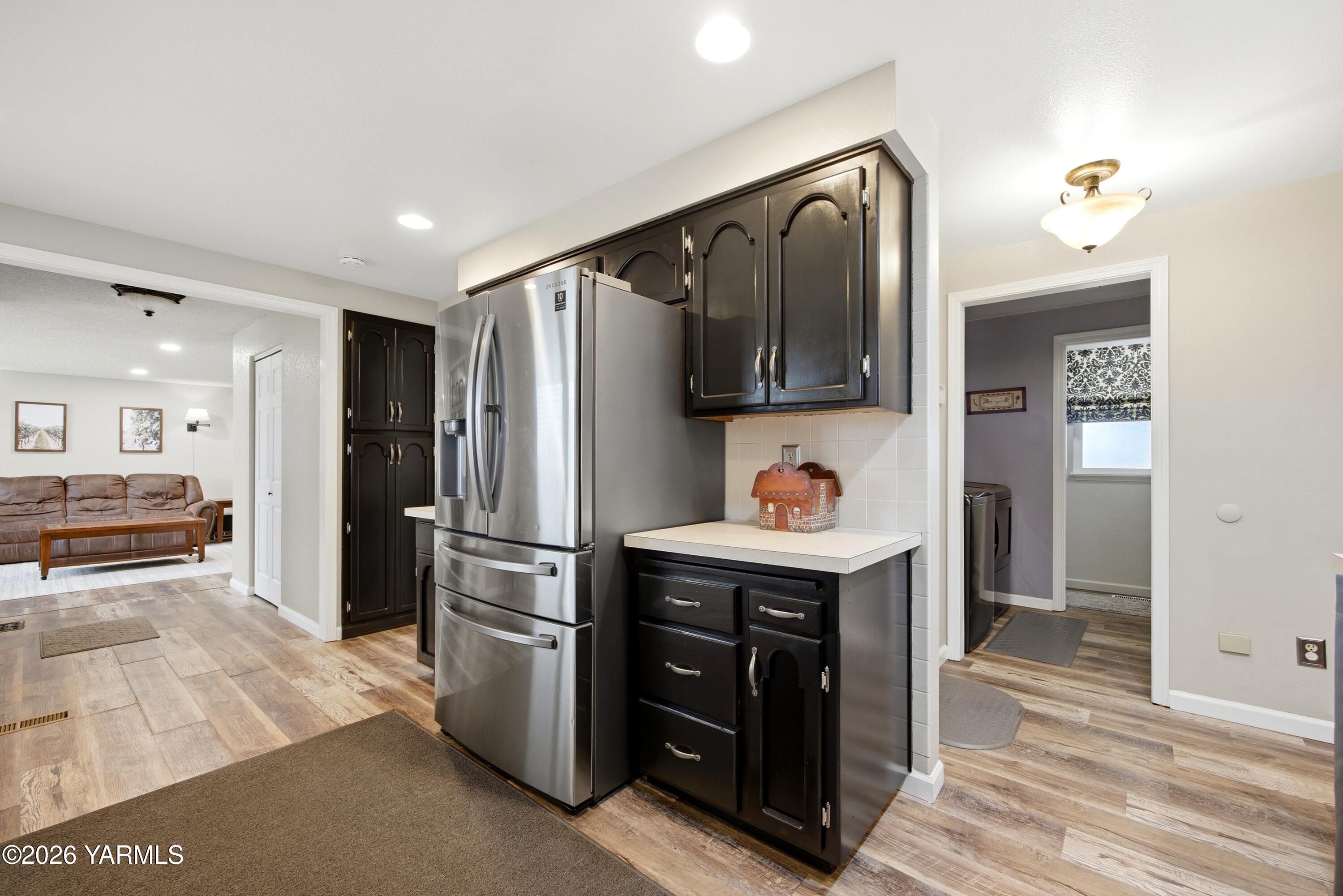 1681 Olmstead Road Grandview, WA 98930 - Photo 40 of 49 a kitchen with stainless steel appliances granite countertop a refrigerator and a sink