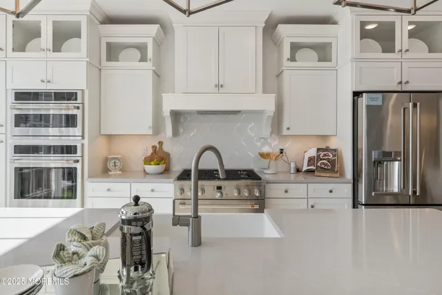a kitchen with stainless steel appliances cabinets a sink and a counter top space