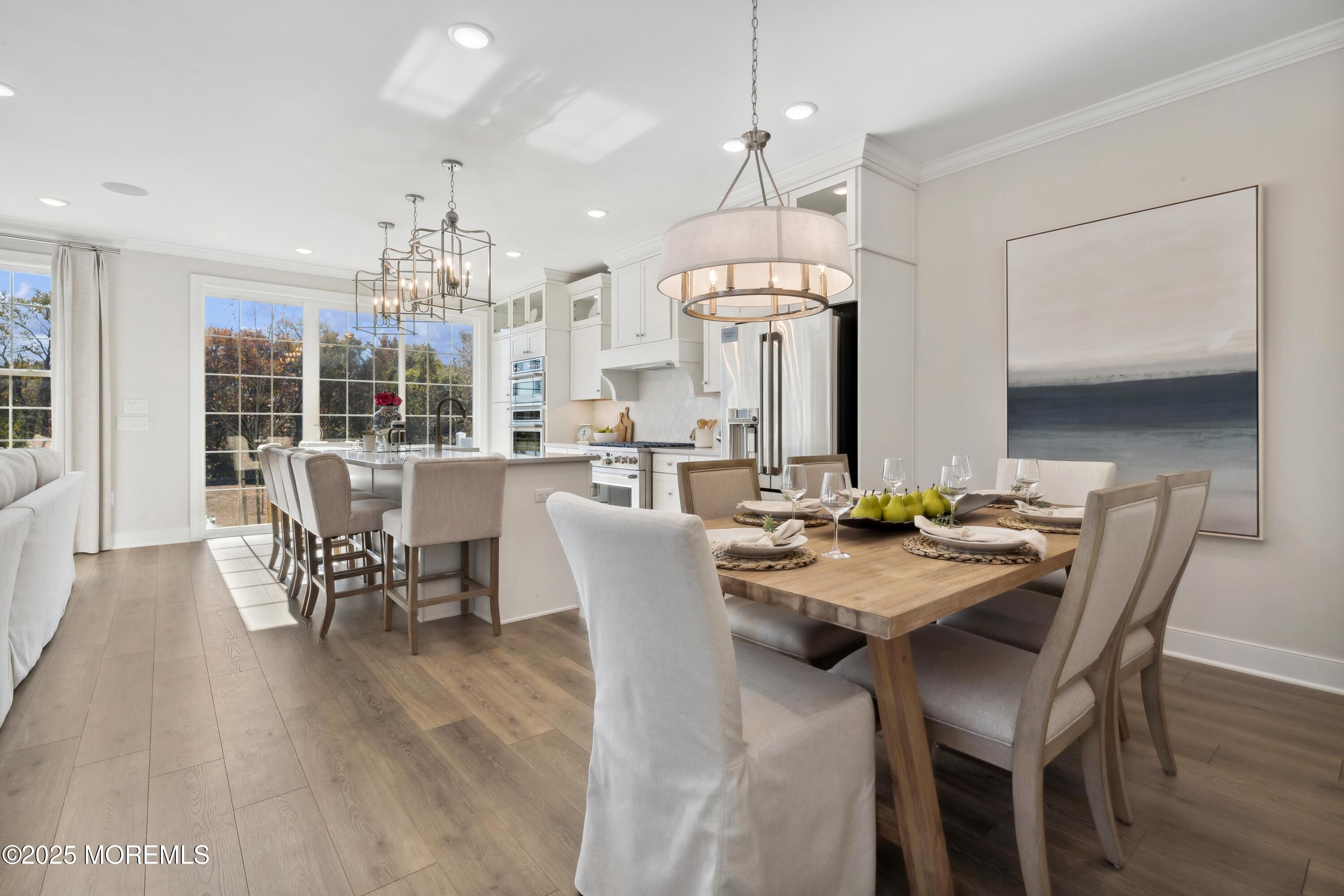 3043 Quail Ridge Boulevard Farmingdale, NJ 07727 - Photo 16 of 36 a view of a dining room with furniture and chandelier